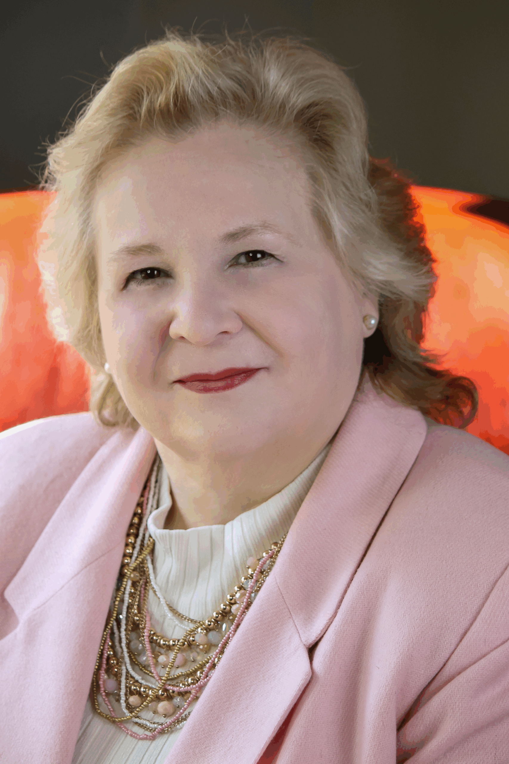 Debbie Ausburn wearing pink coat headshot photo